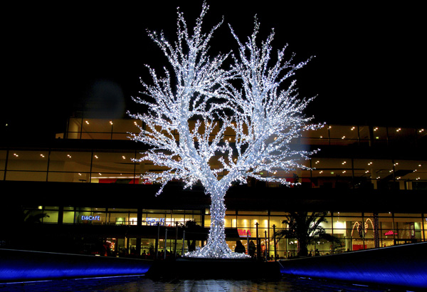  An illuminated tree is seen in front of the Christmas market in Duisburg, western Germany, Friday Dec 5, 2008. (AP Photo/Frank Augstein) 