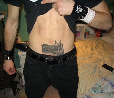 Tattoo of a gun
