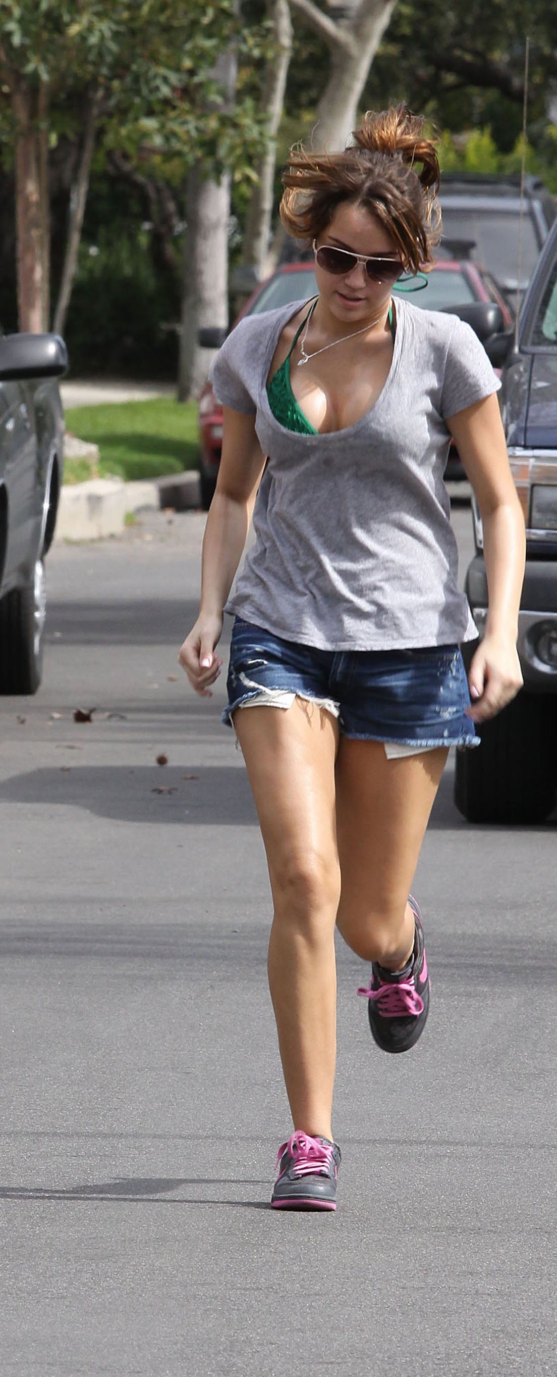 Miley Cyrus Jogging in Bikini Top!!!