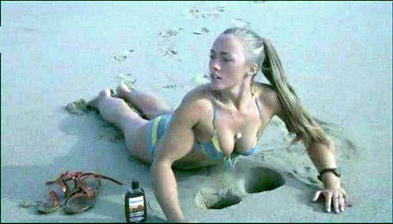 This is a women who is sitting on the beach
