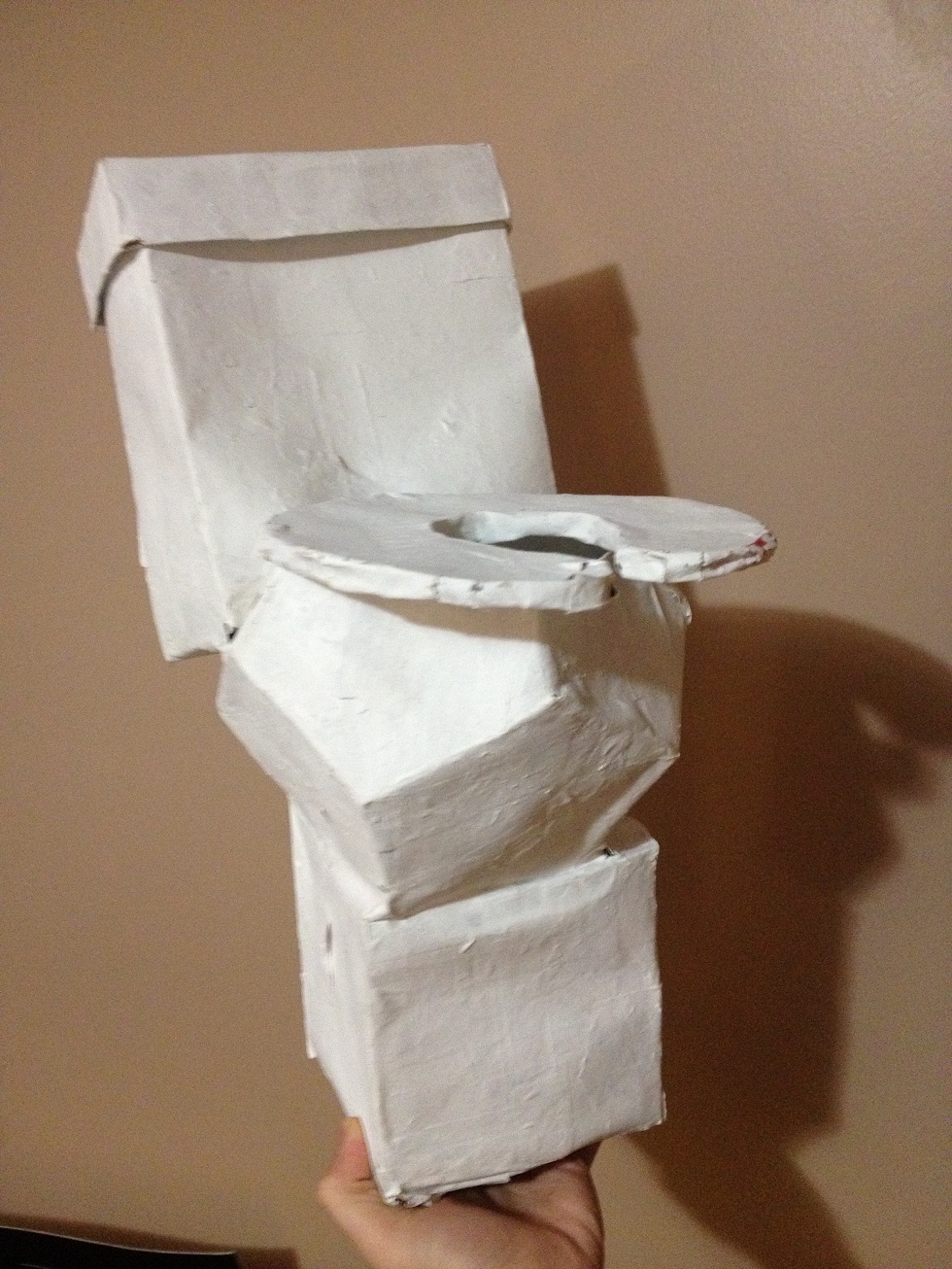 Toilet tissue dispenser made completely out of paper flour water and paint