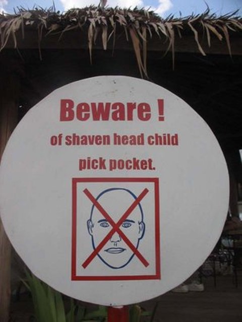 funny signs - Beware! of shaven head child pick pocket.