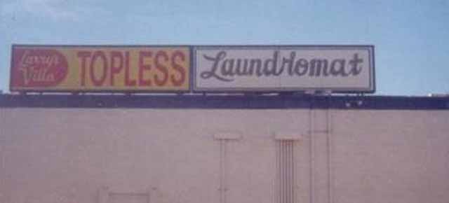 street sign - Topless Laundromat