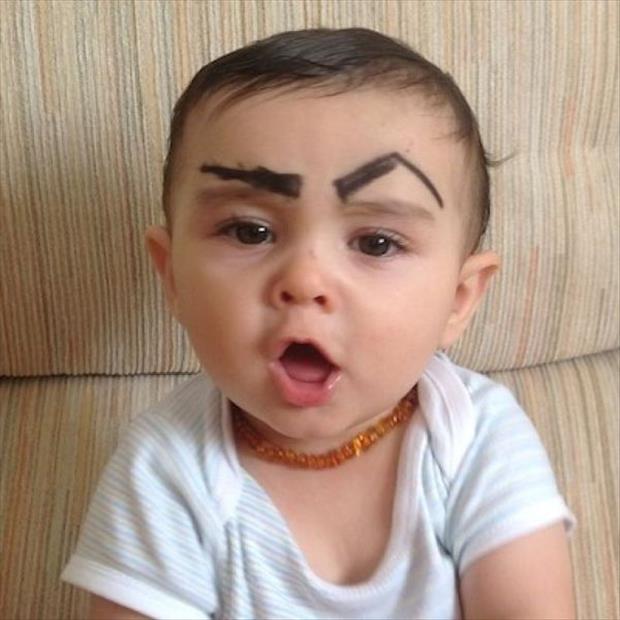 Drawing eyebrows on children.