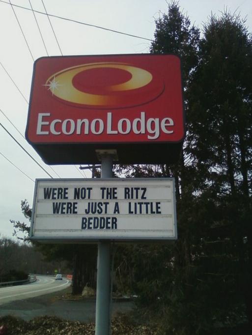 street sign - Econo Lodge Were Not The Ritz Were Just A Little Bedder