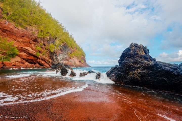 Kaihalulu Red Sand Beach, Hawaii - Due to iron deposits in the surrounding hills, this Hawaiian beach has a stunning red hue. It pairs nicely with Hawaiis green beach.
