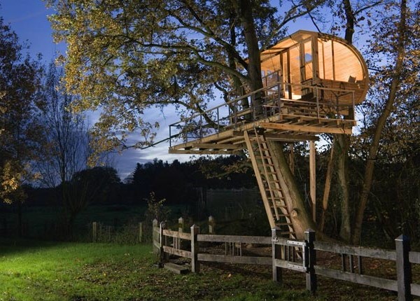 This modern home boasts a sophisticated design with the playful elements that make a tree house. Open to the elements, there's no better place to be one with nature.