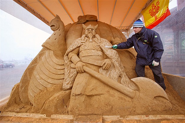 Andrey Molokov from the Chuvash Republic works on his sand sculpture "The Vikings" at a bathing area of the Baltic Sea in Warnemuende, Germany, April 5, 2013. Nine artists from six countries designed sand sculptures under the theme "Fairy Tales and Myths of the Sea."