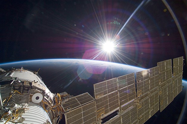 The bright Sun greets the International Space Station in this scene from the Russian section of the orbital outpost.