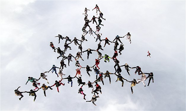 Sixty-three women skydivers set a new world record for the largest all-female formation while jumping head down, Nov. 30, 2013, in Eloy, Ariz. The record was certified by the Federation of Aeronautics International.