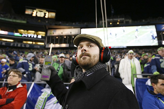 Matt Roe, an acoustical consultant with SSA Acoustics, measures noise levels in CenturyLink Field during an NFL football game between the Seattle Seahawks and the New Orleans Saints, Dec. 2, 2013, in Seattle. Fans set a Guinness World Record for crowd noise during the game, at 137.6 decibels.