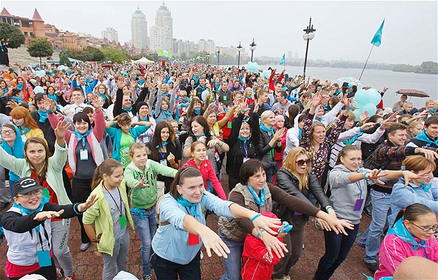 People take part in a mass morning exercise in Kiev, Ukraine, Sept. 30, 2012. About 15,000 people participated in the event to establish a new Guinness World Record for the most amount of people taking part in a mass morning exercise, organizers said.