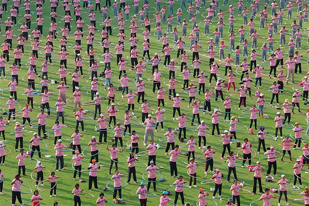 People take part in an attempt to break the Guinness World Record for most number of people simultaneously hula-hooping at Thammasat University stadium in Pathum Thani province, on the outskirts of Bangkok, Thailand, Feb. 12, 2013. Thailand broke the previous record held by Taiwan, with a new record of 4483 people hula-hooping for 7 minutes. The event was organized by the public health ministry to promote exercise and good health.