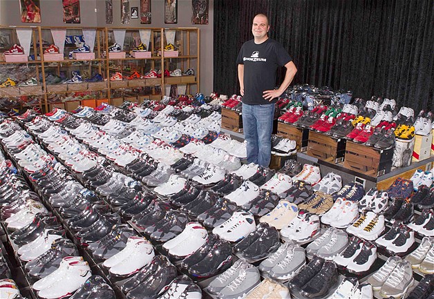 Jordan Michael Geller poses with his collection of the Nike Air Jordan Retro line at the "ShoeZeum" in downtown Las Vegas, Nevada, Sept. 25, 2012. Record keepers at the Guinness Book of World Records recently certified that Geller's ShoeZeum, a shrine to Nike that he says includes one of every model of Air Jordans ever made, holds the record for the world's largest collection of sneakers, with more than 2,500 pairs, all but 8 of which are Nikes.