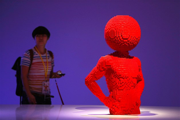 A visitor looks at "The Circle Torso" during the media preview of "The Art of the Brick" exhibition in Singapore, Nov. 15, 2012. The exhibition featured 52 original Lego creations from New York artist Nathan Sawaya.