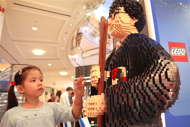 A girl touches a Harry Potter mannequin made of Legos in Singapore, June 13, 2005.