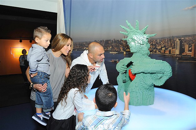 Melissa and Joe Gorga with their kids Antonia, Gino and Joey, take a close look at the Statue of Liberty's heart as part of "The Art of the Brick" exhibition by artist Nathan Sawaya in New York City, Oct. 13, 2013.