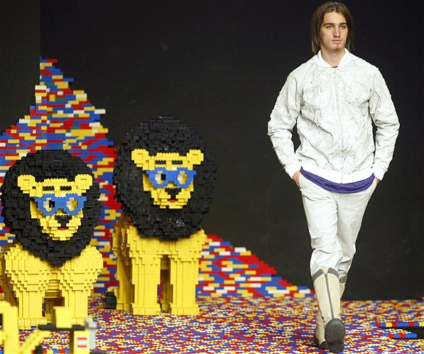 A model struts down the catwalk next to some Lego cats i.e. lions as part of V. Rom's 2003 AutumnWinter high fashion collection at Sao Paulo Fashion Week in Sao Paulo, Brazil, Feb. 1, 2003.
