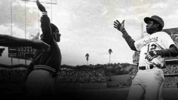Glenn Burkes and Dusty Baker, of the LA Dodgers, perform what it believed to be the first high-five. 2 October, 1977