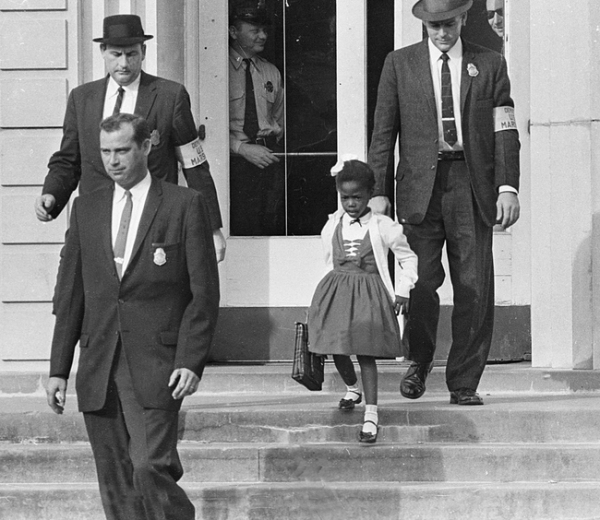 Ruby Bridges becomes the first African American to attend an all-white elementary school in the South. She was followed everywhere by US Marshals because of threats on her life. 1960