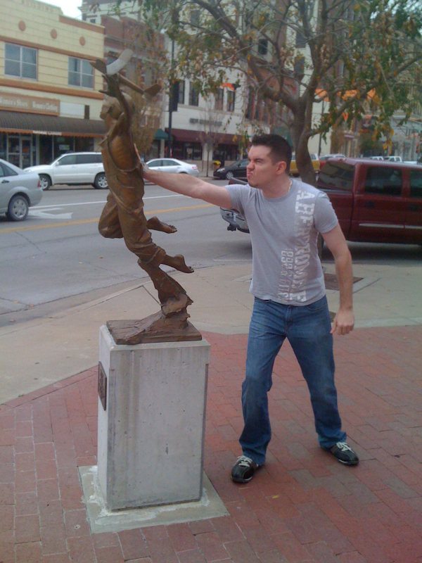 43 people having fun with statues
