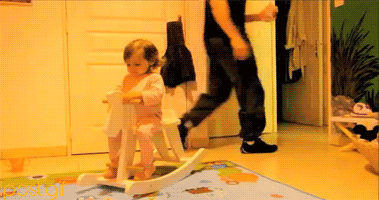 being a dad little girl on rocking horse gif