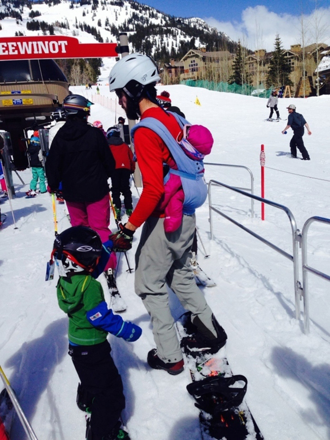 being a dad skiing with baby in backpack