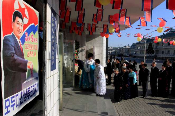 During elections in North Korea, there is only one name on the ballot box. Electors can vote by writing "Yes" or "No" on the ballot paper. Pictured Voters line up to cast their ballots during elections in Pyongyang, North Korea.