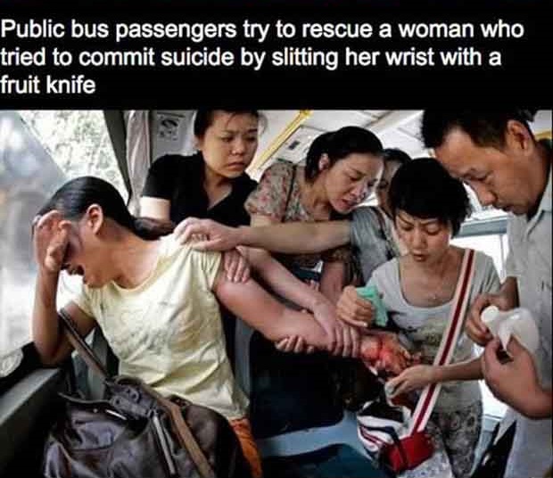 powerful images of humanity - Public bus passengers try to rescue a woman who tried to commit suicide by slitting her wrist with a fruit knife