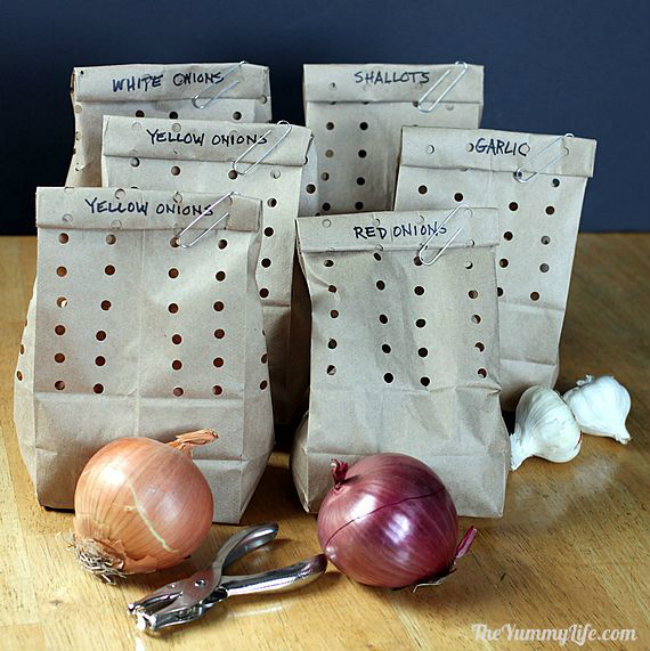 Hide garlic and onions in holey paper bags. They’ll stay fresh for at least two months without molding.