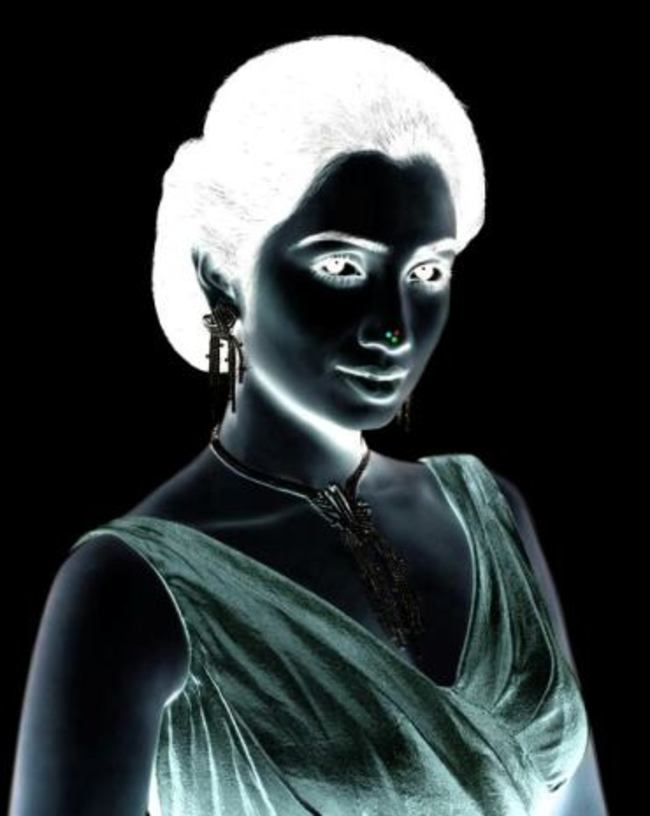 Stare at this lady's nose for 10 seconds, then blink rapidly while looking at a light surface. Her face will appear in full color.