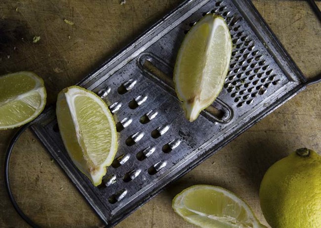 Use a slice of lemon to clean built up food off of a cheese grater.