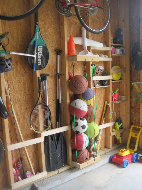 Use bungie cords to store sports balls in a way that saves tons of space.
