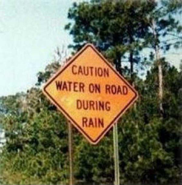useless sign - Caution Water On Road During Rain
