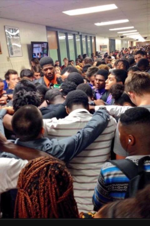 These students gathered to mourn the loss of one student's mother to cancer.