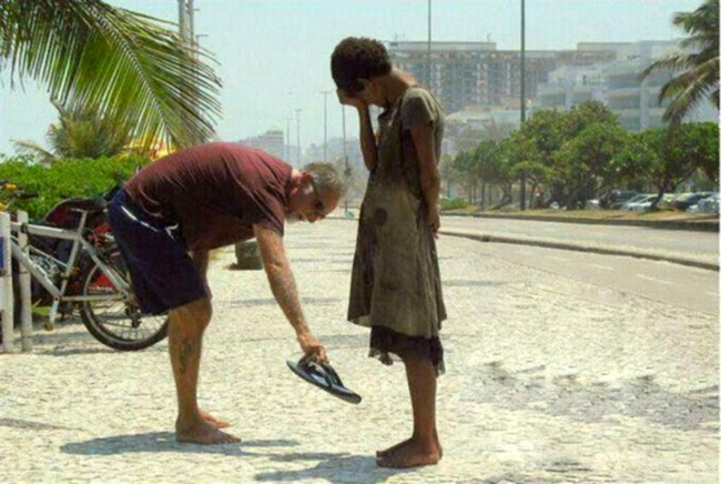 He gave his shoes to someone who didn't have any.