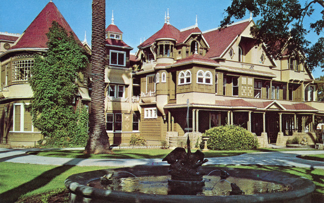 The Winchester Mystery House, San Jose, California. In 1862, a woman named Sarah Winchester was hit with tragedy when both her six-month-old baby and her husband died within a few short years of each other. She consulted a psychic, who told her to move west and build a house so twisted that even the evil spirits cursing her would get confused.