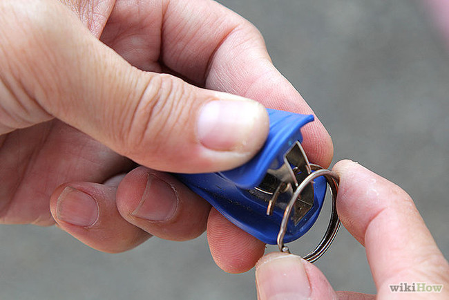Use a staple remover to get a frustrating key ring open.