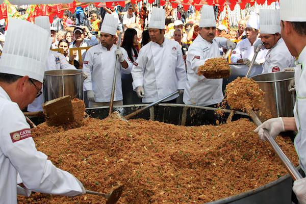 52 chefs set the world record for the largest Cantonese fried rice cooked at one time. The record was set in February of 2013, serving over 7,000 people and weighing in at 3,000 pounds.