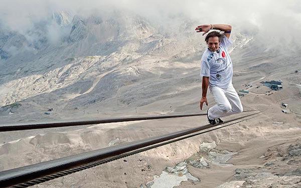 Freddy Nock from Switzerland balances on the ropeway of a cable car leading to Germany’s highest mountain, the 9,718 feet Zugspitze. Nock balanced on the 3264.4 feet-long rope to break his own world record.