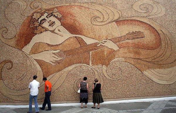 Albanian artist Saimir Strati set a record by glueing 229,764 corks of various shapes and colors over a plastic banner measuring 42.5 by 23 feet to make the art piece. He worked 14 hours a day for 28 days straight.