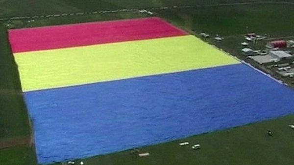 Romania set the Guinness World Record for world’s biggest national flag in Clinceni in May of this year. The flag measured 1,146 feet long by 744 feet tall.