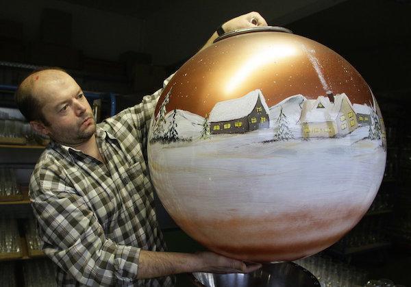 Franz Paternosta holds up a Christmas tree bauble in the Bavarian glassblowing company Joska on December 17, 2008. The company produced the world’s biggest glass Christmas tree decoration with a diameter of 25.6 inches and a weight of 44 pounds.