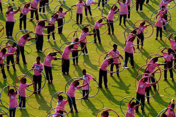 In February 2013, 4,483 people hula-hooped for seven minutes at Thammasat University stadium on the outskirts of Bangkok, setting the Guinness World Record for most number of people simultaneously hula-hooping.