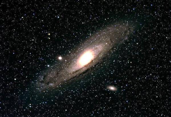 You can see another galaxy with the naked eye: The Andromeda Galaxy, 2.2 million light years away.