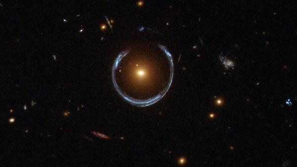 There is a bizarre phenomenon that scientists call gravitational lensing which happens when gravity bends light to the point that objects appear in a different location to where they actually exist. A solitary black hole betrays its presence solely through gravity, which bends and warps the light of more distant objects.