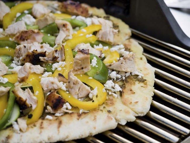 Pizza isn't traditional barbecue fare, but it can be cooked on a grill for a smokey flavor
