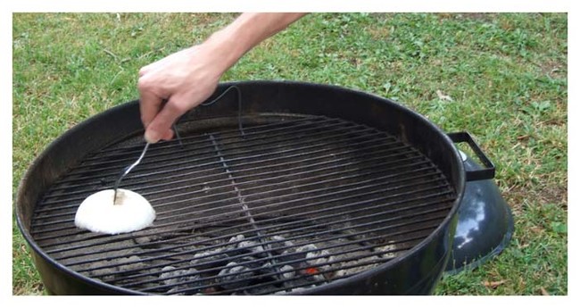Or you can clean your grill with an onion. The oils will help break up grease and give your food more flavor