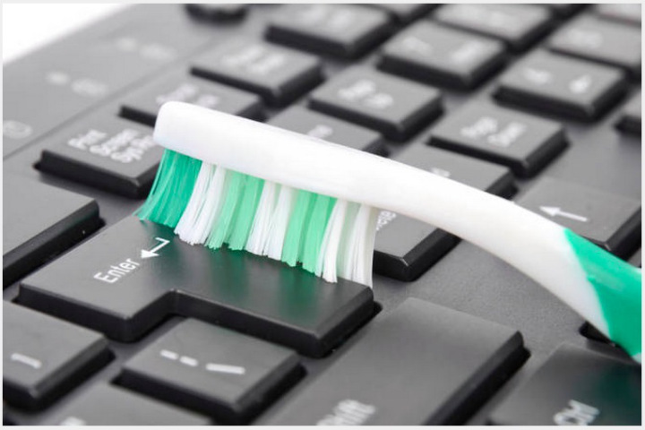 Clean your keyboard with a toothbrush