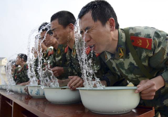 Training is sometimes aimed at pushing troops to their absolute limit: Here, paramilitary police in China train at holding their breaths underwater.